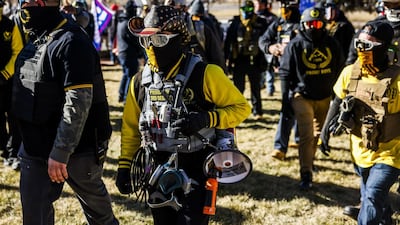 Members of the Proud Boys join Donald Trump supporters outside the Colorado State Capitol on January 6, 2021 in Denver, Colorado. Getty Images/AFP
