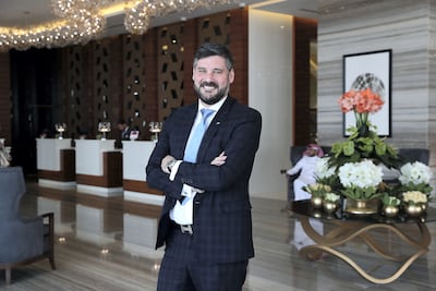 David Allan, cluster general manager for Radisson Blu Hotels in Dubai Waterfront, Dubai Canal View and Raddison Resort, Ras Al Khaimah, expects fans to be planning ahead to watch the late kick-offs. Pawan Singh / The National