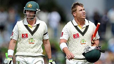 Phil Hughes, left, and David Warner are guiding Australia towards victory.