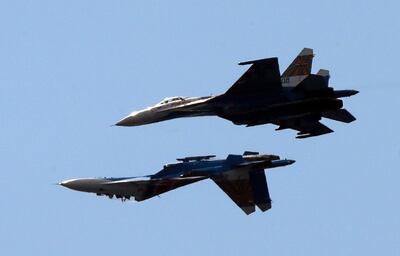 (FILE) - Two Russian SU-27 aircraft perform during the International Maritime Defence Show (IMDS) in St. Petersburg, Russia, 07 July 2013 (reissued 14 March 2023). The United States European Command (EUCOM) said in a statement that two Russian Su-27 aircraft 'conducted an unsafe and unprofessional intercept' with a US unmanned MQ-9 aircraft that was operating within international airspace over the Black Sea on 14 March 2023. The incident occurred at about 7:03 AM (CET) when one of the Russian aircraft struck the propeller of the MQ-9 causing US forces to bring the unmanned aircraft down in international waters, the statement added. EPA / ANATOLY MALTSEV *** Local Caption *** 50908986