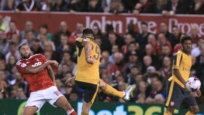 Arsenal’s Granit Xhaka, second left, shoots to score the opening goal. Lindsey Parnaby / AFP