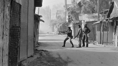 Fighters from Lebanon's Christian Kataeb or Phalangist militia patrol the Christian Palestinian camp of Dbayeh, north of Beirut, on January 28, 1976.