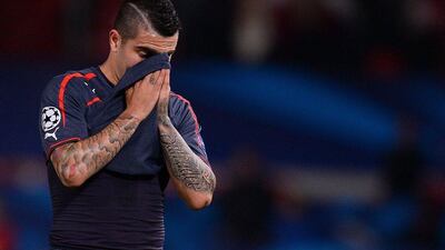 Olympiakos midfielder Paulo Machado reacts as he leaves the pitch following the loss on Wednesday to Manchester United. Andrew Yates / AFP / March 19, 2014
