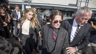 Johnny Depp and his wife, Amber Heard, leave the Southport Magistrates Court on Australia’s Gold Coast on April 18. Dave Hunt / AAP / Reuters