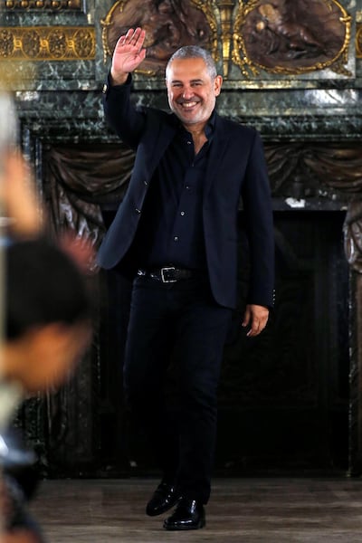 Designer Elie Saab takes a bow after his autumn/winter 2019 show during Paris Fashion Week. Reuters