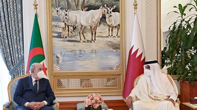 Qatar's Emir Sheikh Tamim bin Hamad Al Thani (R) receives Algerian President Abdelmadjid Tebboune at the Emiri Diwan in Doha. AFP