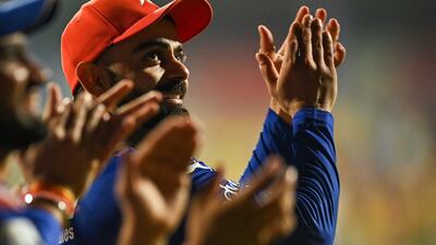Virat Kohli celebrates qualifying for the IPL 2024 playoffs at the M Chinnaswamy Stadium. AFP