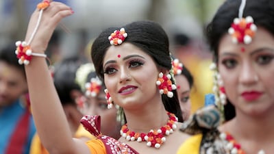 Indian students perform a dance to a Tagore song as they celebrate the Holi festival at Tagore University in Kolkata, eastern India. The Rabindra Bharati University organized the festival of colors at their campus. Holi is an ancient Indian festival to mark the arrival of spring. EPA