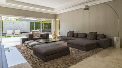 The lounge leads straight out into the garden. Courtesy LuxuryProperty.com