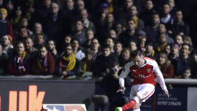 Arsenal's Lucas Perez scores against Sutton United in FA Cup fifth-round match at Gander Green Lane stadium in London, Monday, February 20, 2017. Matt Dunham / AP Photo