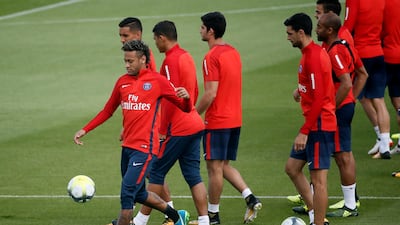 Neymar, left, trains with his new Paris Saint-Germain teammates on August 11, 2017, ahead of his debut for the club. EPA