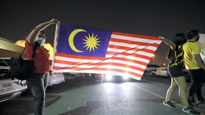 Malaysia fans arrive at the stadium before the game. Chris Whiteoak / The National