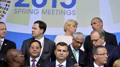 The Greek finance minister Yanis Varoufakis (top right) takes his place for a group photo of International Monetary and Financial Committee (IMFC) governors, during the IMF and World Bank's 2015 Annual Spring Meetings, in Washington on April 18, 2015. Mike Theiler / Reuters