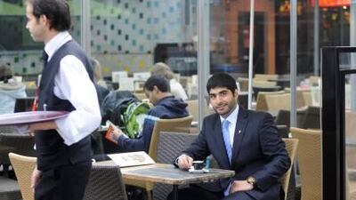 Mohammed Hamza Al Qasimi, who works for a private French oil company, enjoys a coffee in Paris. A new Great Place to Work list will rate private sector companies that welcome Emiratis.