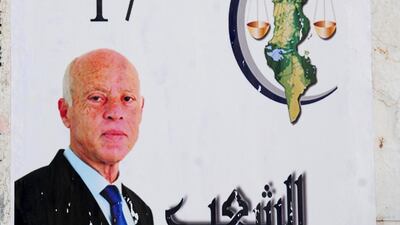 A campaign poster for independent presidential candidate Kais Saied, a constitutional law professor. AP Photo