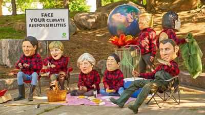 Oxfam activists wear masks of G7 leaders as they protest during the G7 Summit in Quebec City, Canada. Andre Pichette / EPA