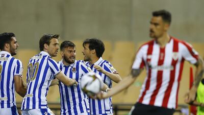 Real Sociedad's Mikel Oyarzabal celebrates scoring their first goal with teammates. Reuters