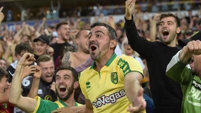 Norwich fans celebrate after beating Manchester City. EPA