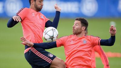 Bayern Munich players Medhi Benatia (L) and Xabi Alonso (R) perform during their team’s training session in Munich, Germany, 02 May 2016. FC Bayern Munich will face Atletico Madrid in the Uefa Champions League semi final, second leg match in Munich on 03 May 2016. EPA/ANDREAS GEBERT