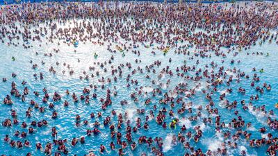 People enjoying a pool at a water park in Zhengzhou, in China's central Henan province. AFP