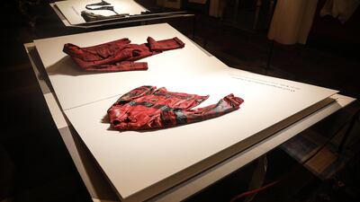 Custom-created book pages replace mannequins in A Short Novel on Men’s Fashion exhibition. Courtesy Pitti Immagine Uomo