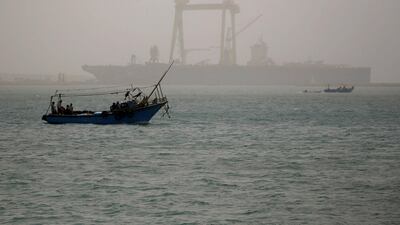 A boat is seen on a dusty weather in Suez near the Suez Canal, Egypt. The recent spike to oil prices from the disruption to Suez traffic has lifted prices, which remained bearish following renewed concerns of Covid-19 infections. REUTERS/Amr Abdallah Dalsh
