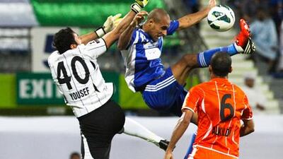 Ajman scramble to clear an Al Nasr attack.