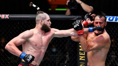 Jiri Prochazka, left, of the Czech Republic punches Dominick Reyes during their light heavyweight bout at UFC APEX. Zuffa LLC