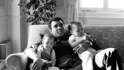 Muhammad Ali is seen cuddling his daughters Laila, left, and Hana, right, at a Hotel in London, Britain December 19, 1978. Action Images / MSI / File Photo