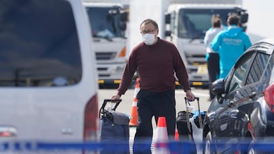 A passenger of the Diamond Princess cruise ship leaves the Daikoku Pier Cruise Terminal in Yokohama. EPA