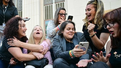 Lawyer Laura Marquez-Garrett, third right, and relatives of victims react after a jury decided that Meta and YouTube were liable for designing their platforms to hook young users without concern for their wellbeing, outside the Los Angeles Superior Court, in California, US. AFP