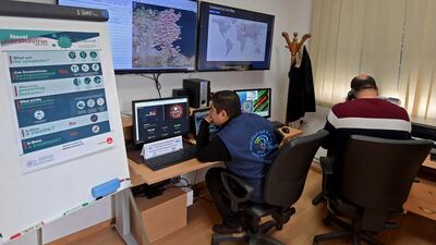 Members of the Tunisian health ministry's coronavirus disease crisis cell respond to phonecalls at their premises at the ministry headquarters in the capital Tunis. AFP