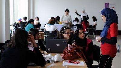 Young women work on projects as part of a 'Women's Start-up Weekend' at Algeria 2.0, an event designed to encourage entrepreneurship.