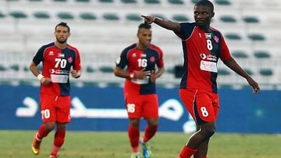 Naseer Khamis of Al Shaab (8) celebrates after scoring the against Al Shabab to help them to a 2-1 victory that keeps them in the Pro League for next season.