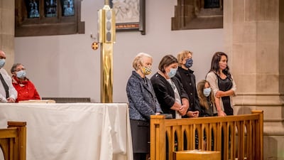 Pat Hume, left, is pictured alongside family members as her late husband John Hume lies at rest in St Eugene's Cathedral. Getty Images