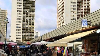The food market and apartment buildings at the Val Fourre neighbourhood in Mantes La Jolie, a Paris suburb.