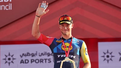 Lidl-Trek's Italian rider Jonathan Milan celebrates on the podium after finishing first in the seventh and final stage. AFP