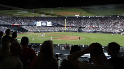 Baseball fans look on during the first of a two-game series between the New York Yankees and the Boston Red Sox at London Stadium in Queen Elizabeth Olympic Park, east London. As Major League Baseball prepares to make history in London, New York Yankees manager Aaron Boone and Boston Red Sox coach Alex Cora are united in their desire to make the ground-breaking trip memorable on and off the field. AFP