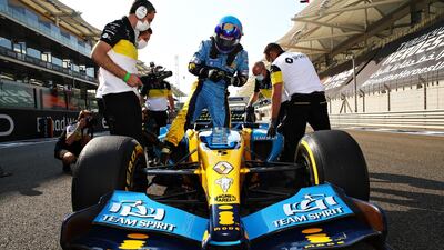Fernando Alonso and Renault Sport F1 team members with his 2005 F1 title winning Renault R25. Getty