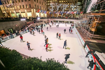 People are seen ice skating in Manhattan, New York City at the Rockefeller Centre rink in front of the 2019 Christmas Tree at the 5th Ave between 49th and 50th Streets. The rink is a symbol, a tradition and an attraction for tourists in NYC. Getty Images