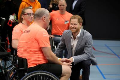 Prince Harry speaks with athletes during a training session at Sportcampus Zuiderpark in The Hague as part of a programme of events to mark the official launch of of the Invictus Games in 2020. Reuters