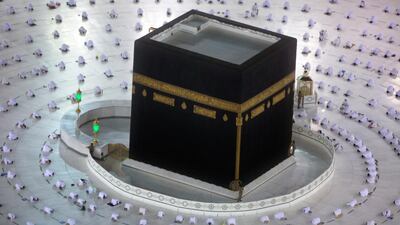 Muslims pray during the first dawn prayers of the Islamic holy month of Ramadan, around the Kaaba, the cubic building at the Grand Mosque, as they keep social distancing to help curb the spread of the coronavirus, in the Muslim holy city of Mecca, Saudi Arabia. During Ramadan, the holiest month in the Islamic calendar, Muslims refrain from eating, drinking, smoking and sex from dawn to dusk. AP Photo
