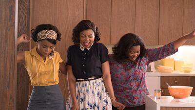 Mary Jackson (Janelle Monae, left), Katherine Johnson (Taraji P. Henson) and Dorothy Vaughan (Octavia Spencer) celebrate their stunning achievements in one of the greatest operations in history in Hidden Figures. Hopper Stone / Twentieth Century Fox