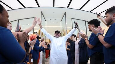 Muhammad Shaka, a Pakistani living in Dubai, was the first customer to get the Apple iPhone 17 and Air at the Apple Store in The Dubai Mall. Chris Whiteoak / The National