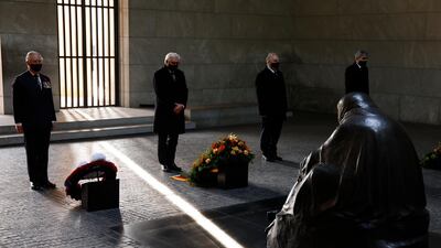 Britain's Prince Charles, Prince of Wales, German President Frank-Walter Steinmeier, President of the German Federal Council Reiner Haseloff and head judge of Germany's constitutional court Stephan Harbarth, from left, pay their respects during a wreath-laying ceremony on national Memorial Day at the Neue Wache in Berlin. AP