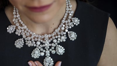 An employee displays a diamond necklace, Harry Winston, circa 1973, set with eight pear-shaped diamonds weighing from 3.77 to 20.72 carats representing a total of 280 carats. EPA