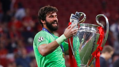 Alisson with the European Cup. Reuters