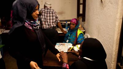 A woman gets her nail painted wiith a marker to indicate that she has been through the voting proccess in the Fort Jesus Museum Polling station in the Mvita Constituency in Mombasa. Ivan Lieman / AFP Photo