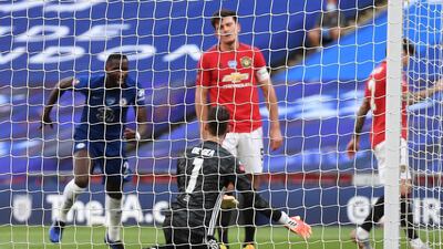 Chelsea's Antonio Rudiger (L) and Manchester United's goalkeeper David de Gea after Manchester Unted's Harry Maguire (C) scored an own goal. EPA