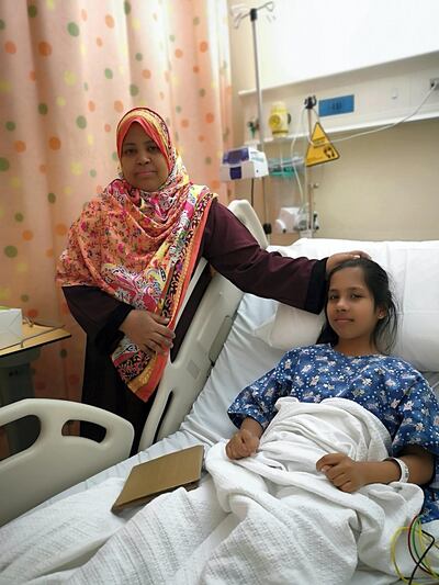Komal recovers at Al Qasimi Hospital with her mother Arifa by her side. Salam Al Amir / The National